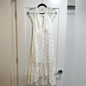 White lace almost to the aisle dress.